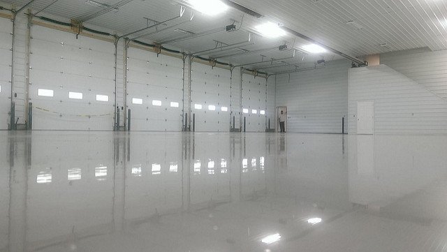 large garage with solid grey epoxy flooring
