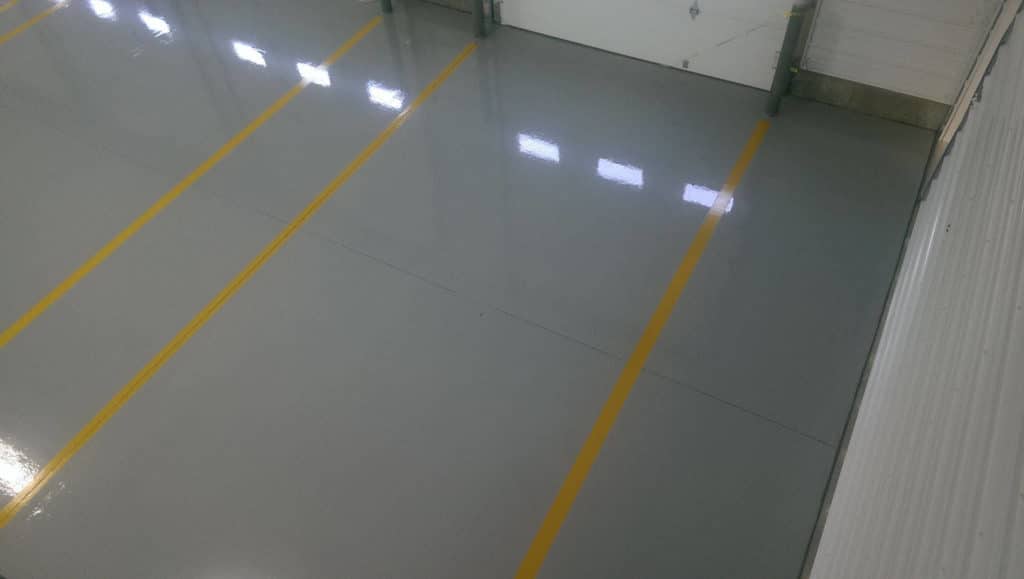 parking spots striped with solid epoxy coatings