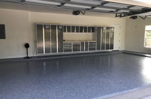 3 Car garage with blue flake epoxy floors