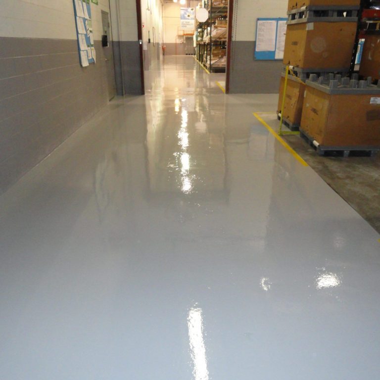 warehouse with striped epoxy floors for organization & low maintenance